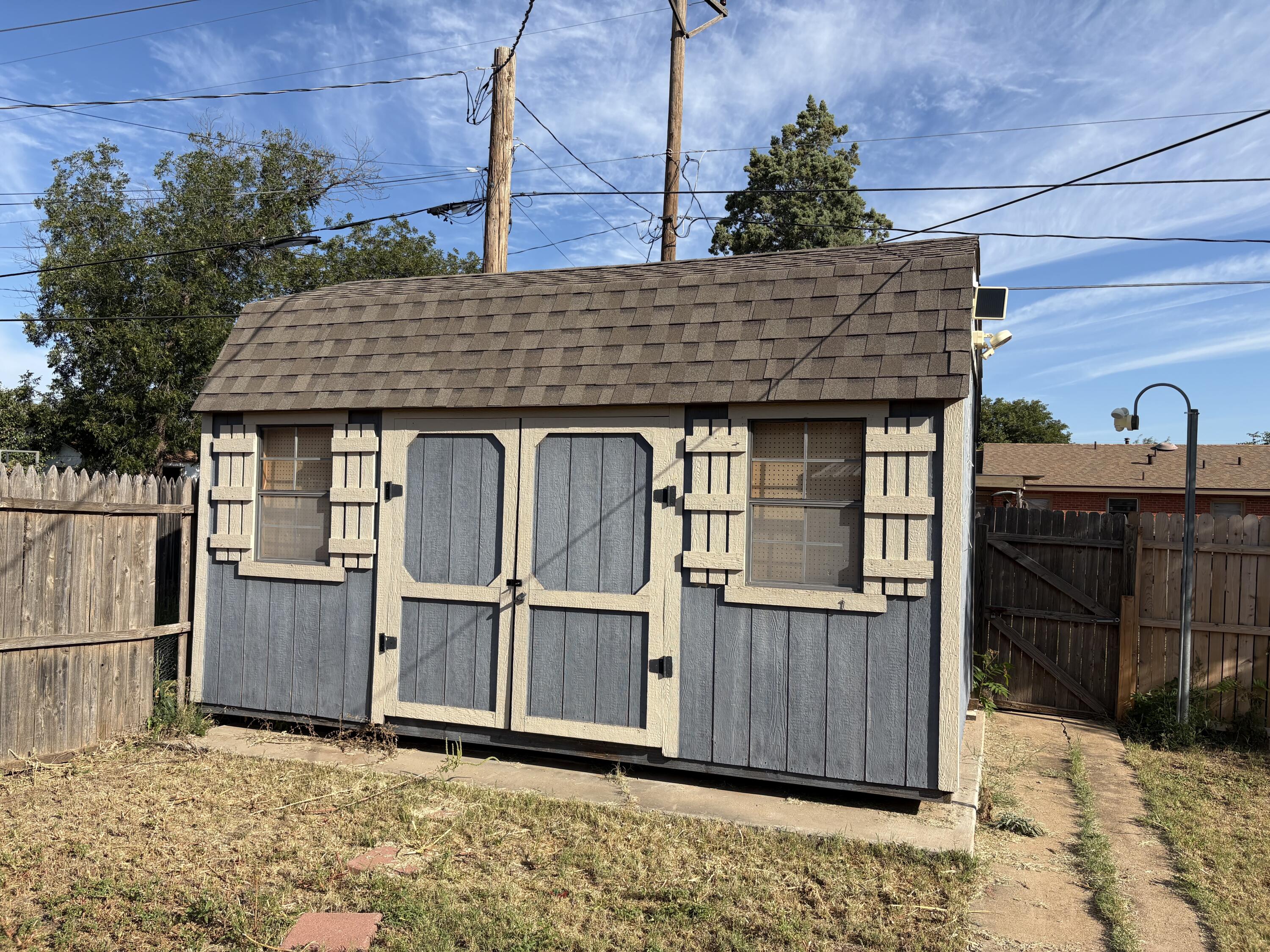 4618 44th Street Lubbock, TX 79414 - Photo 18 of 21 a view of a house with wooden fence