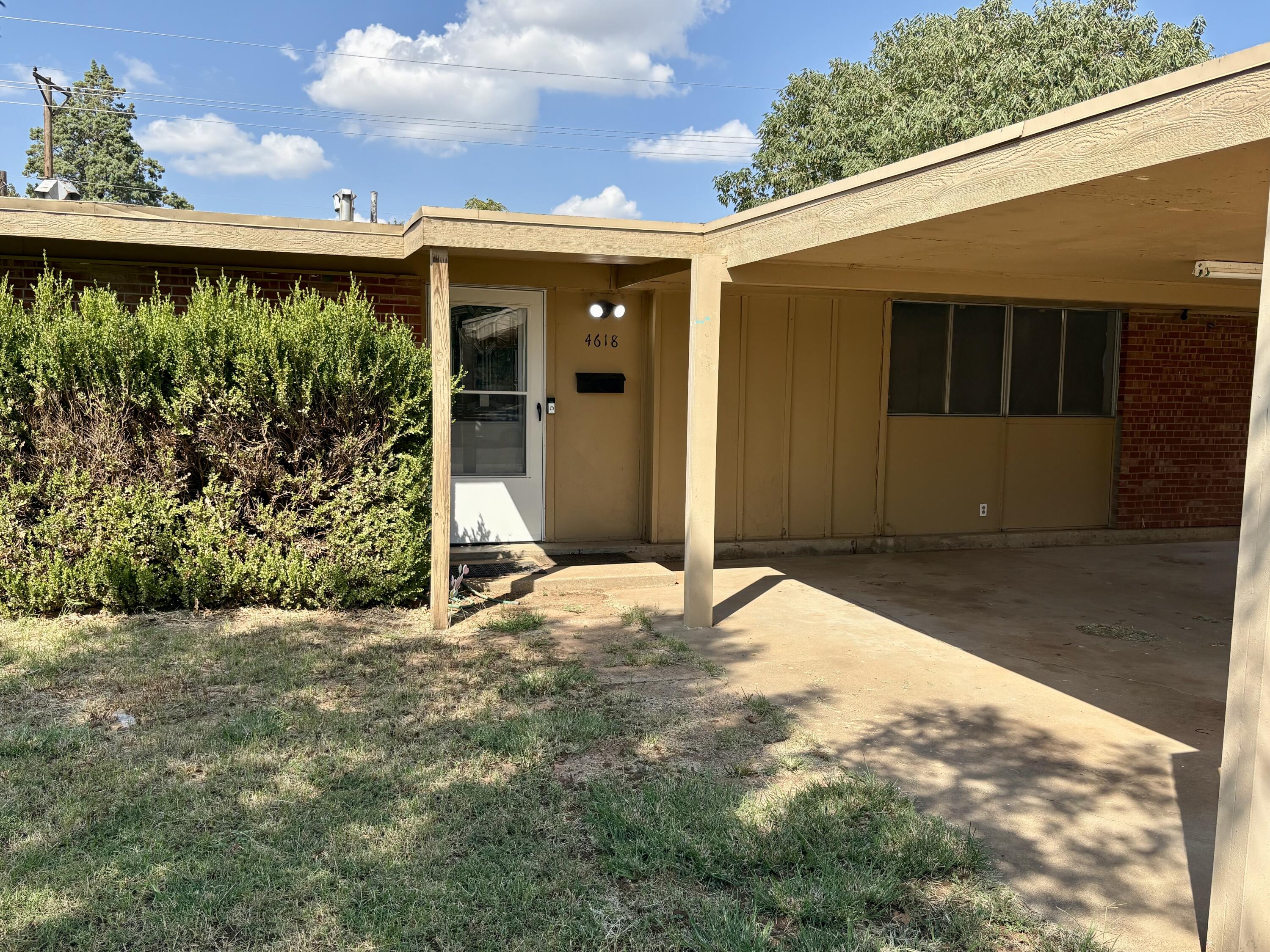 4618 44th Street Lubbock, TX 79414 - Photo 2 of 21 a view of a house with a yard