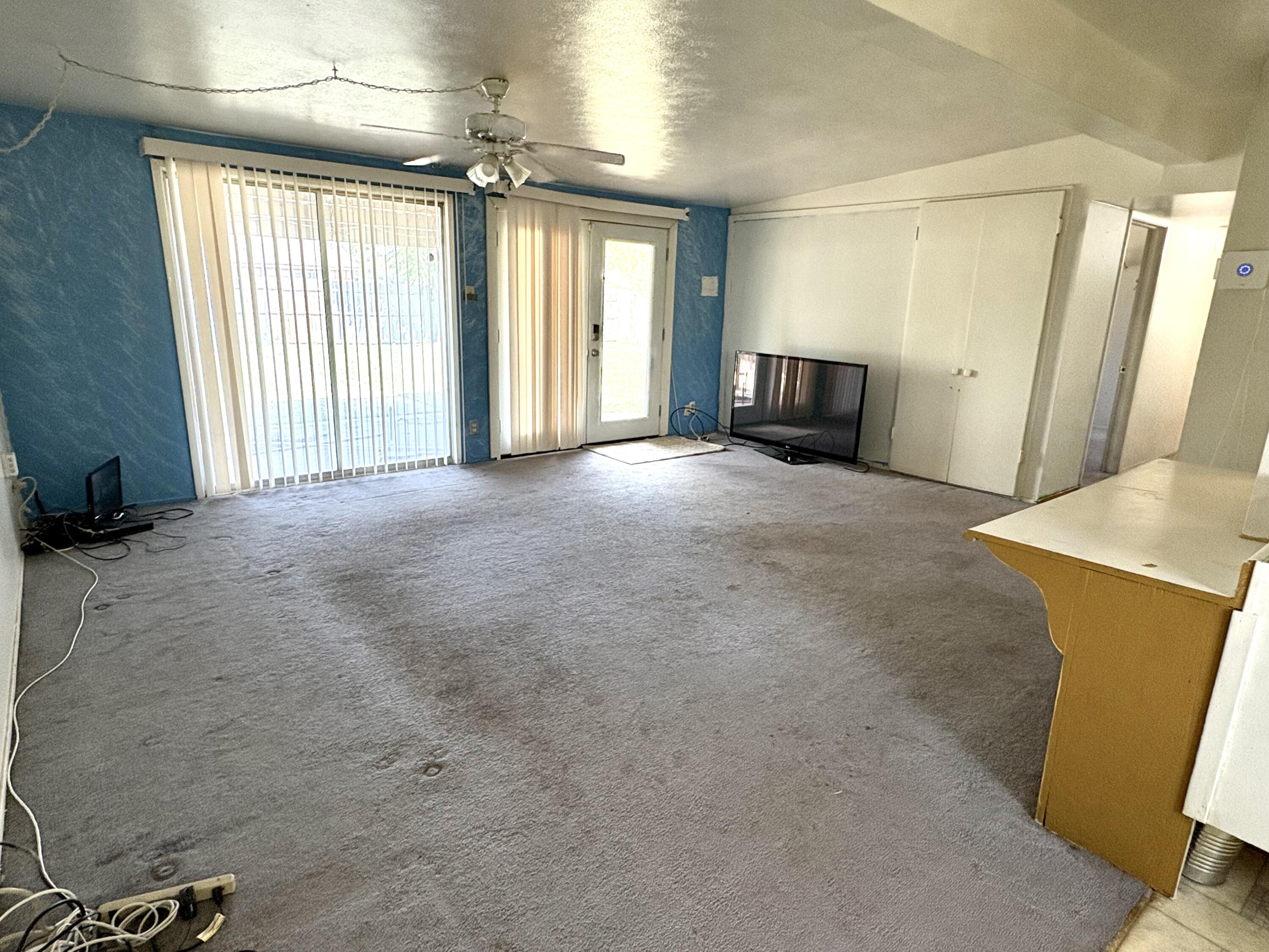 4618 44th Street Lubbock, TX 79414 - Photo 3 of 21 an empty room with windows and cabinet