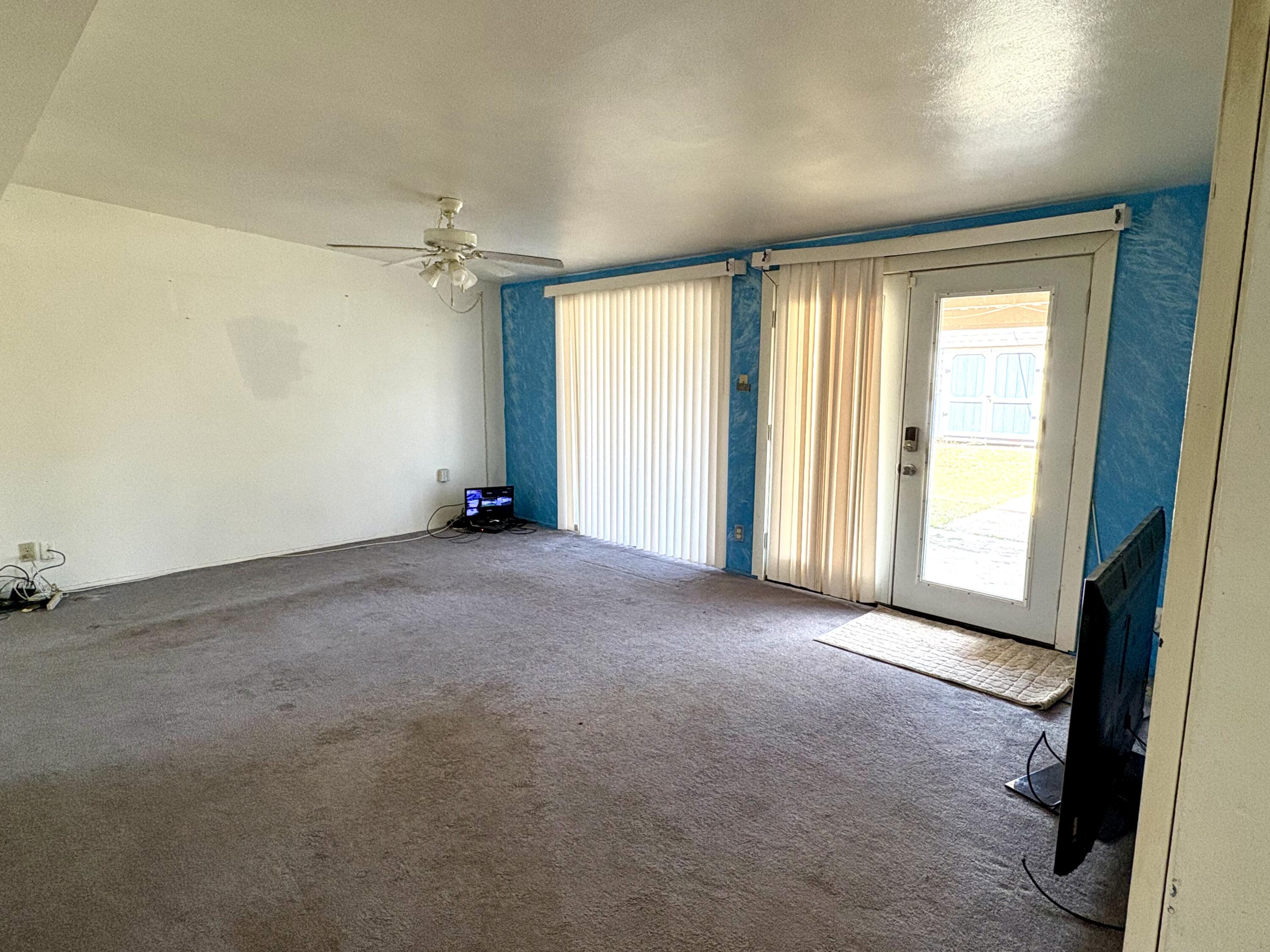 4618 44th Street Lubbock, TX 79414 - Photo 4 of 21 an empty room with windows
