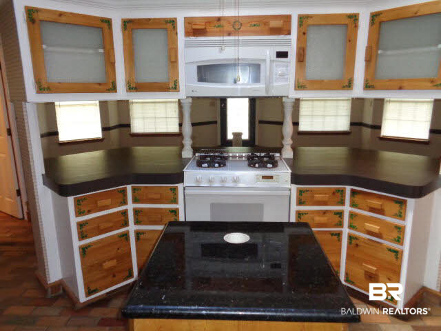 28202 Vargo Lane Elberta, AL 36530 - Photo 9 of 45 Kenmore gas range. GE Profile convection oven/microwave.