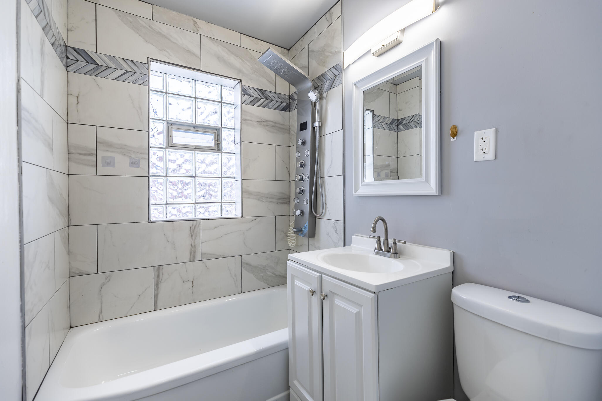 4601 Buchanan Street Gary, IN 46408 - Photo 16 of 27 a bathroom with a sink toilet and shower