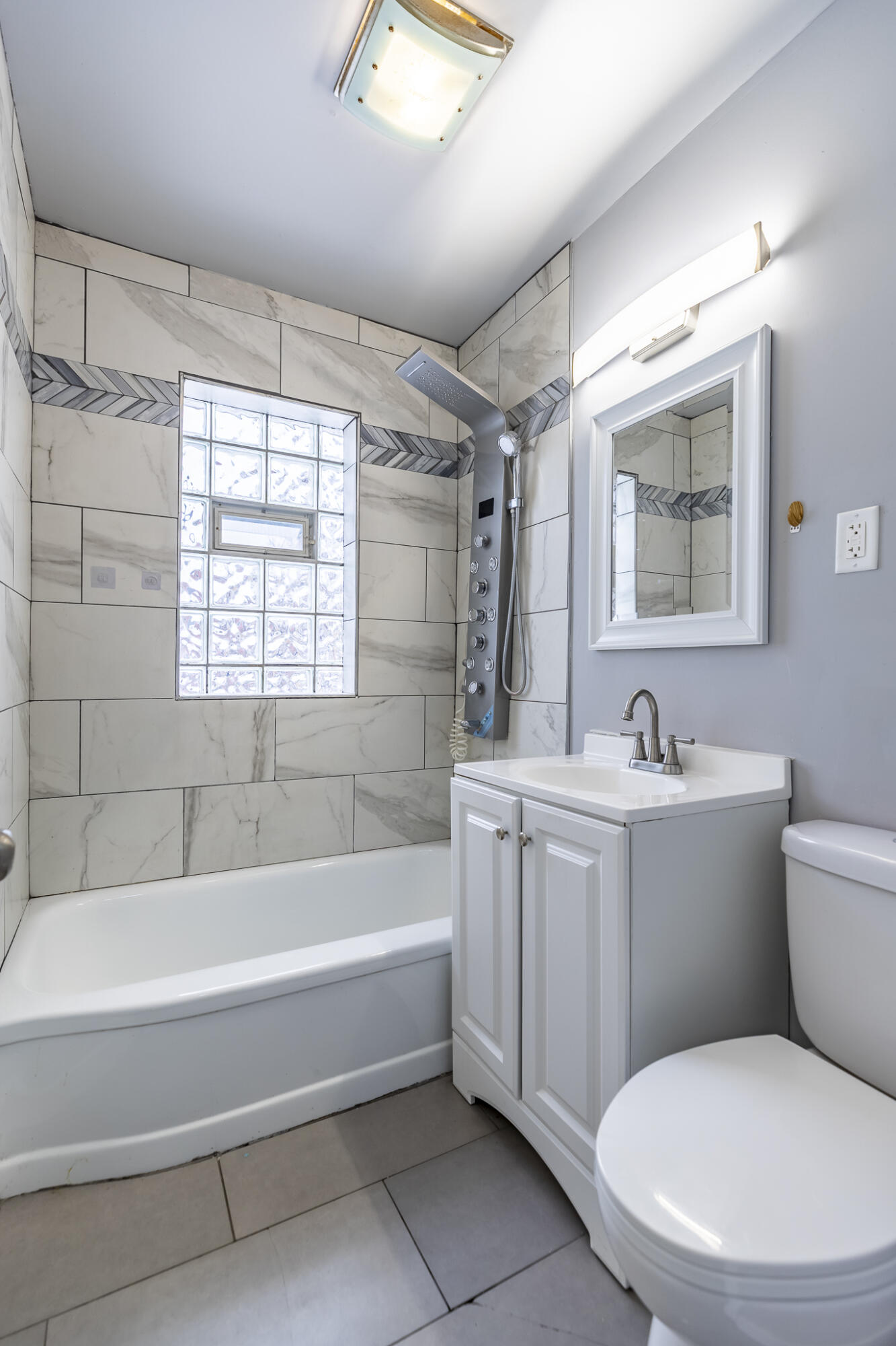4601 Buchanan Street Gary, IN 46408 - Photo 17 of 27 a white bath tub sitting next to a white toilet