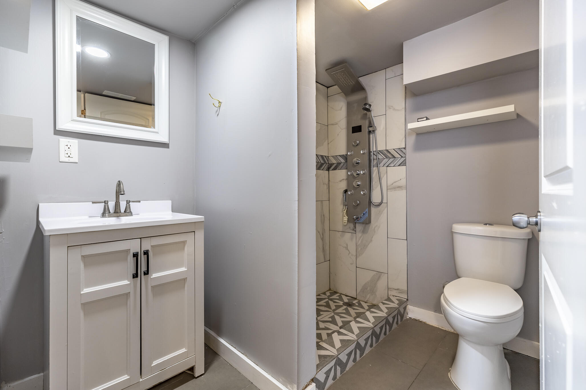 4601 Buchanan Street Gary, IN 46408 - Photo 21 of 27 a bathroom with a toilet sink and shower