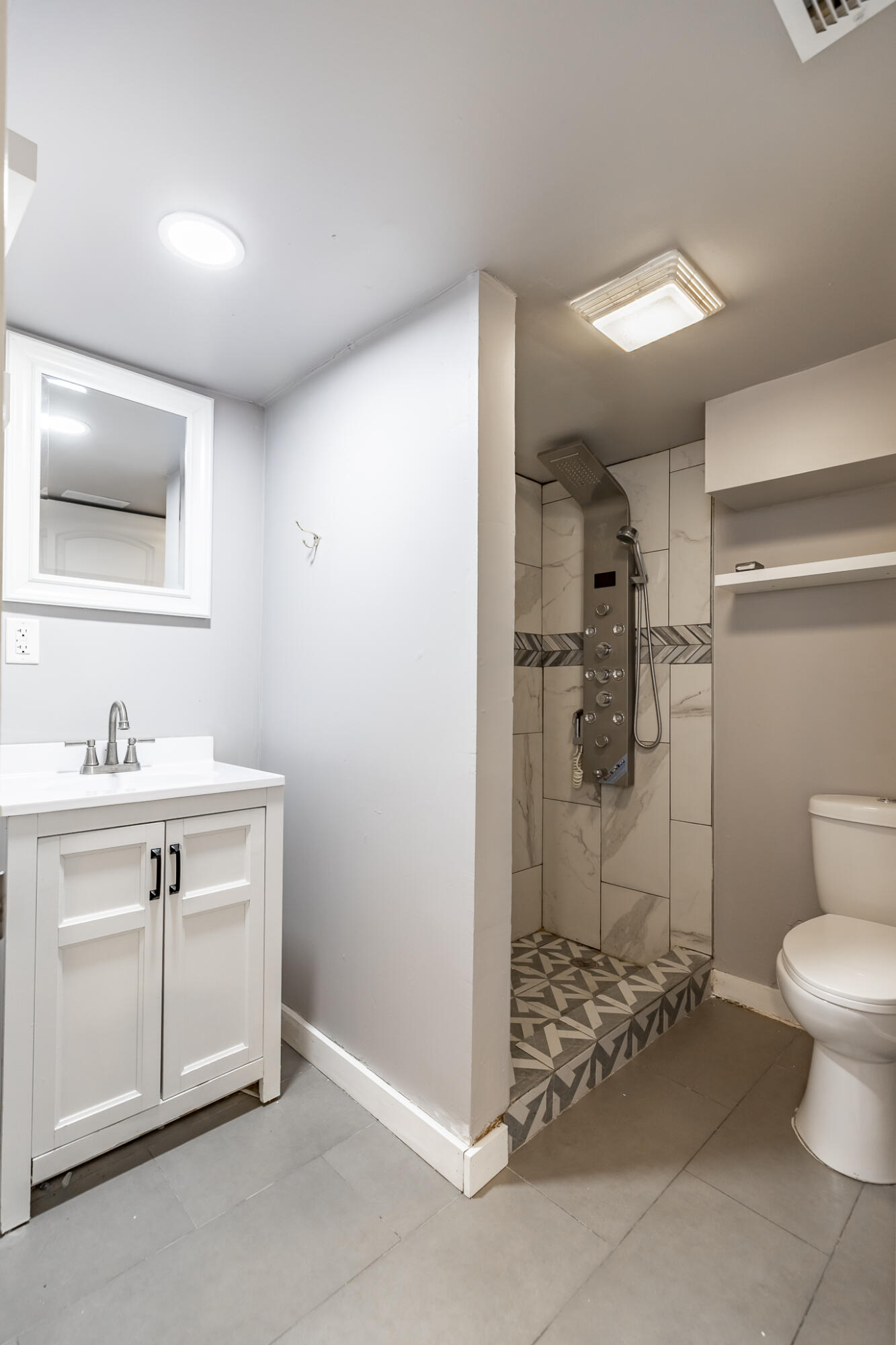4601 Buchanan Street Gary, IN 46408 - Photo 22 of 27 a bathroom with a sink a toilet and shower