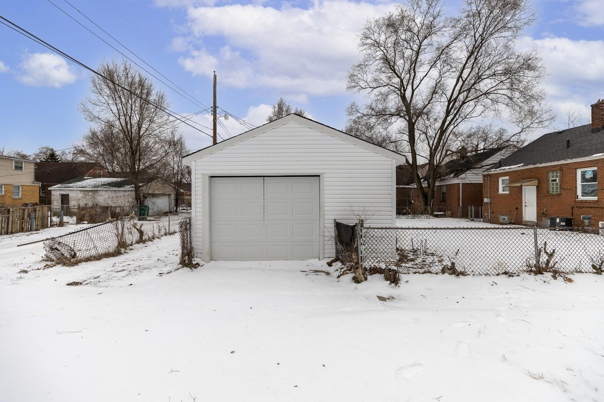 4601 Buchanan Street Gary, IN 46408 - Photo 25 of 27 a view of a house with snow on the road