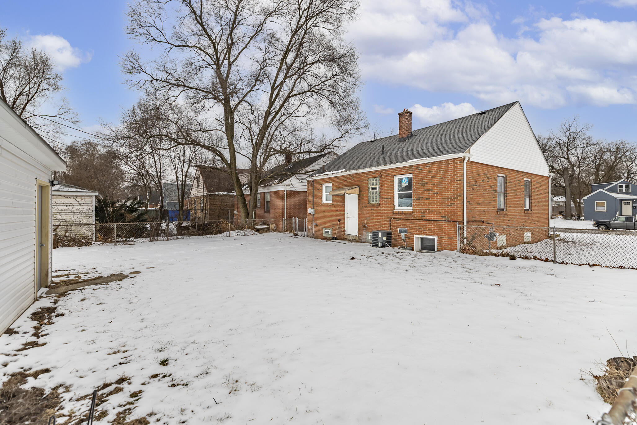 4601 Buchanan Street Gary, IN 46408 - Photo 26 of 27 a view of a house with snow on the road