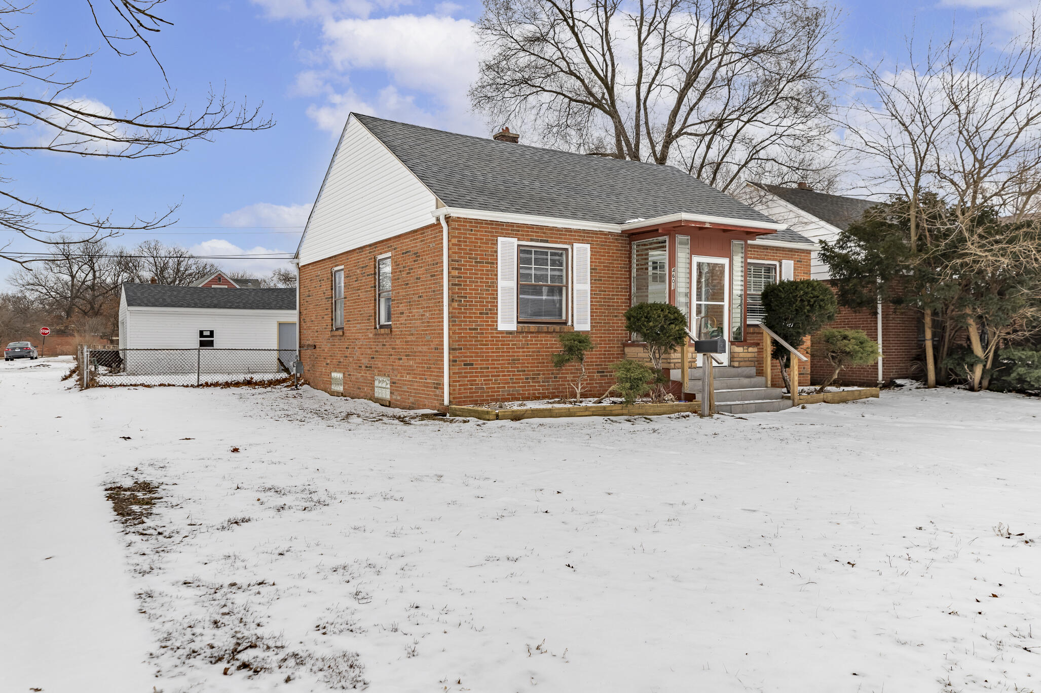 4601 Buchanan Street Gary, IN 46408 - Photo 27 of 27 a front view of a house with large tree