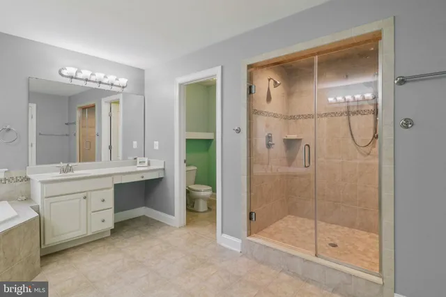 a living room with furniture gym equipment and a large window