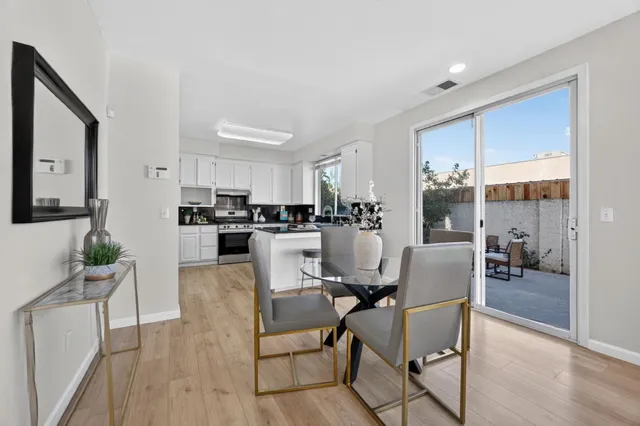a view of a dining room with furniture window and wooden floor