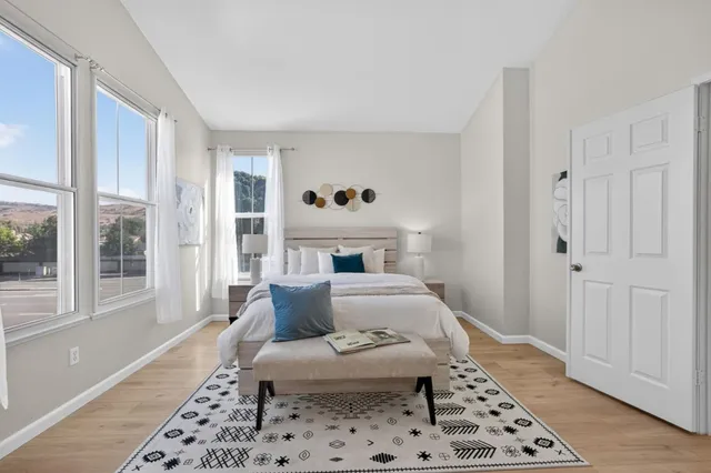 a living room with furniture and a rug