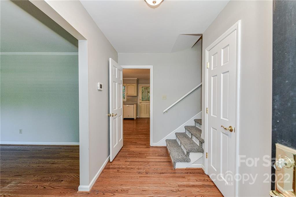 1231 Reverdy Lane, Unit 32 Matthews, NC 28105 - Photo 39 of 39 a view of a hallway with wooden floor and staircase
