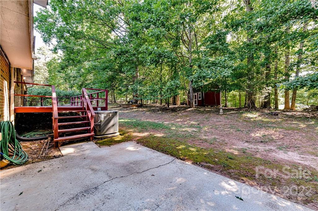 1231 Reverdy Lane, Unit 32 Matthews, NC 28105 - Photo 8 of 39 a view of a backyard with a small barn
