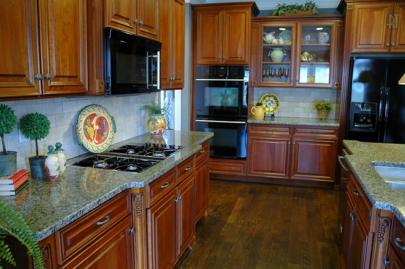 1226 White Rock Road Spring Hill, TN 37174 - Photo 8 of 20 a kitchen with stainless steel appliances granite countertop a stove a sink and a microwave