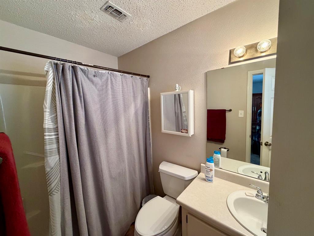 152 County Road Blossom, TX 75416 - Photo 13 of 21 a bathroom with a sink toilet and shower
