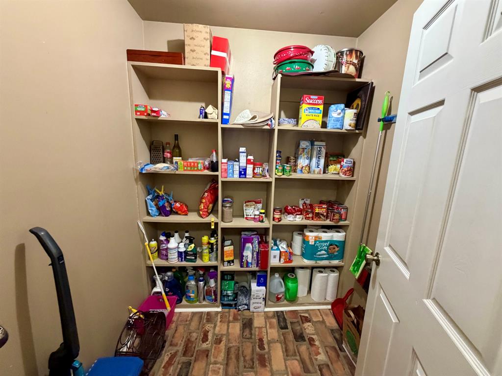 152 County Road Blossom, TX 75416 - Photo 16 of 21 a room with storage and utility