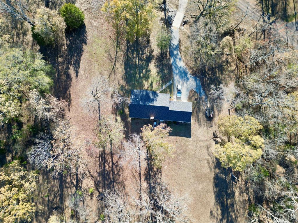 152 County Road Blossom, TX 75416 - Photo 20 of 21 a view of a house with a yard