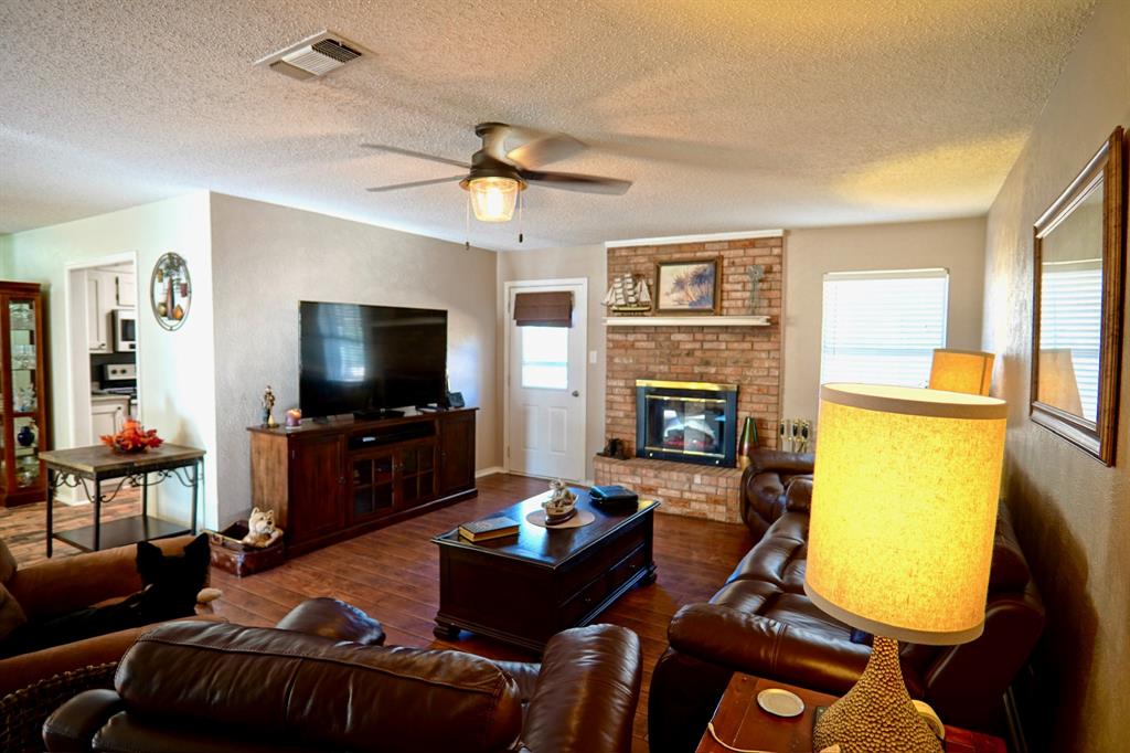 152 County Road Blossom, TX 75416 - Photo 5 of 21 a living room with furniture and a flat screen tv