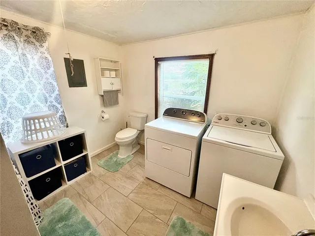 a bathroom with a shower and a toilet