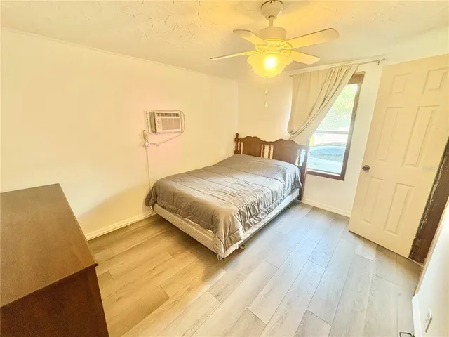 a bedroom with a bed and a walk in closet