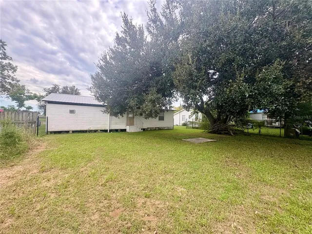 a view of backyard with outdoor space