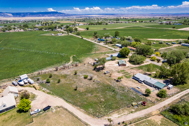 1043 East 4000th Street South Vernal, UT 84078 - Photo 21 of 31 Expansive rural landscape featuring a mix of cultivated fields and undeveloped land