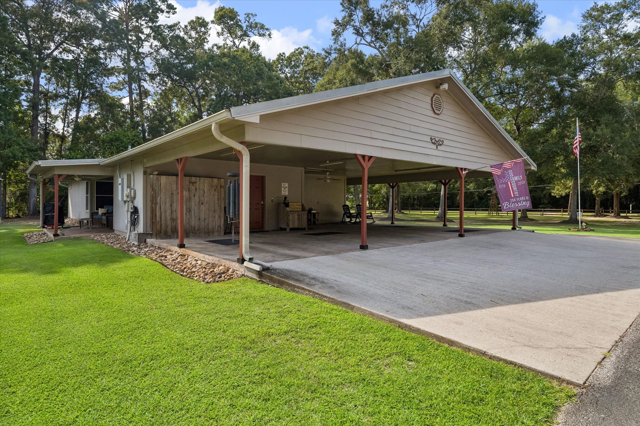 26904 Brentwood Road Splendora, TX 77372 - Photo 13 of 49 Three-car carport and glimpz of covered back patio view of the main home