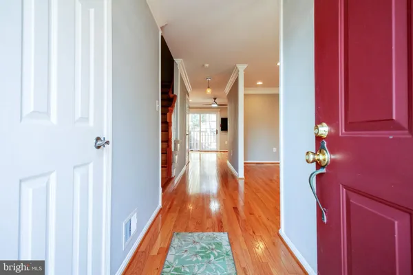a view of entryway with wooden floor