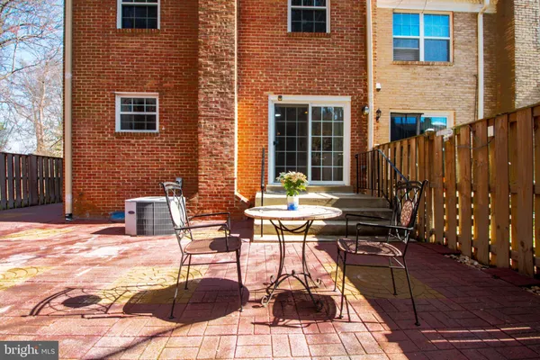 a view of a brick house with many windows