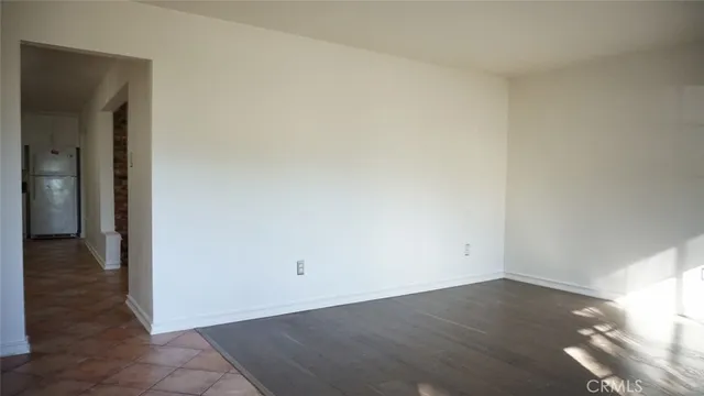 an empty room with wooden floor