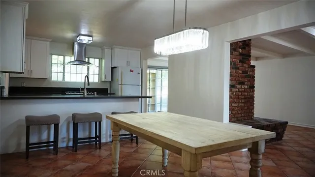 a kitchen with a table and chairs in it
