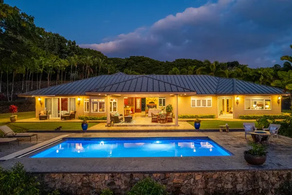 a view of a swimming pool with an outdoor seating