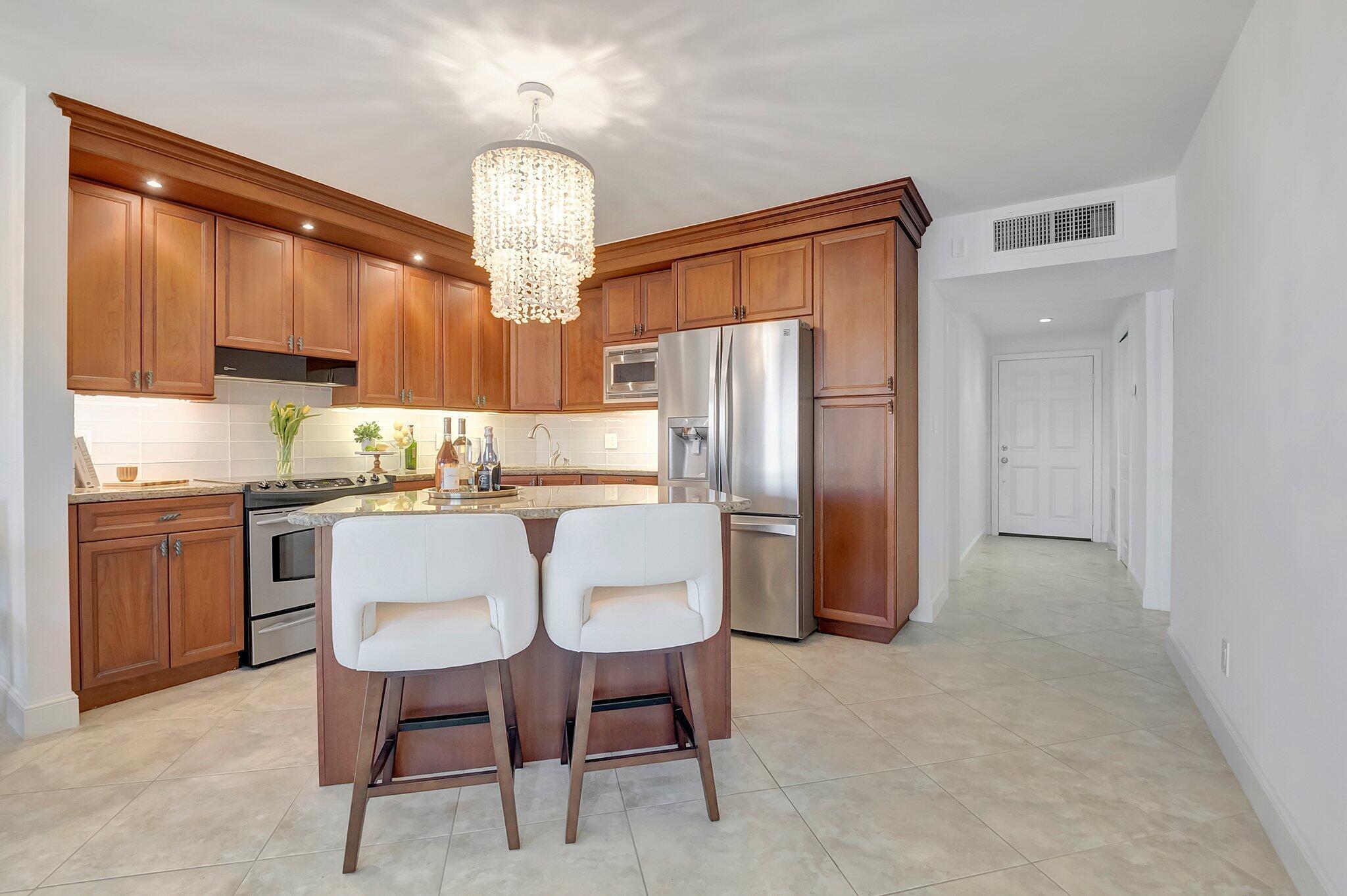 2871 North Ocean Boulevard, Unit D506 Boca Raton, FL 33431 - Photo 5 of 19 Kitchen w/ Island