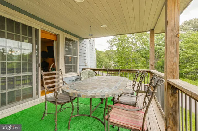a view of a two chairs in the patio