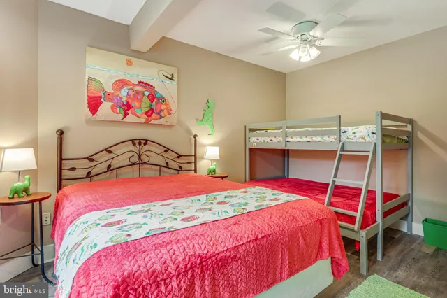 a living room with furniture a flat screen tv and a large window