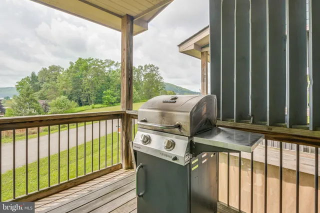 a view of a balcony with furniture