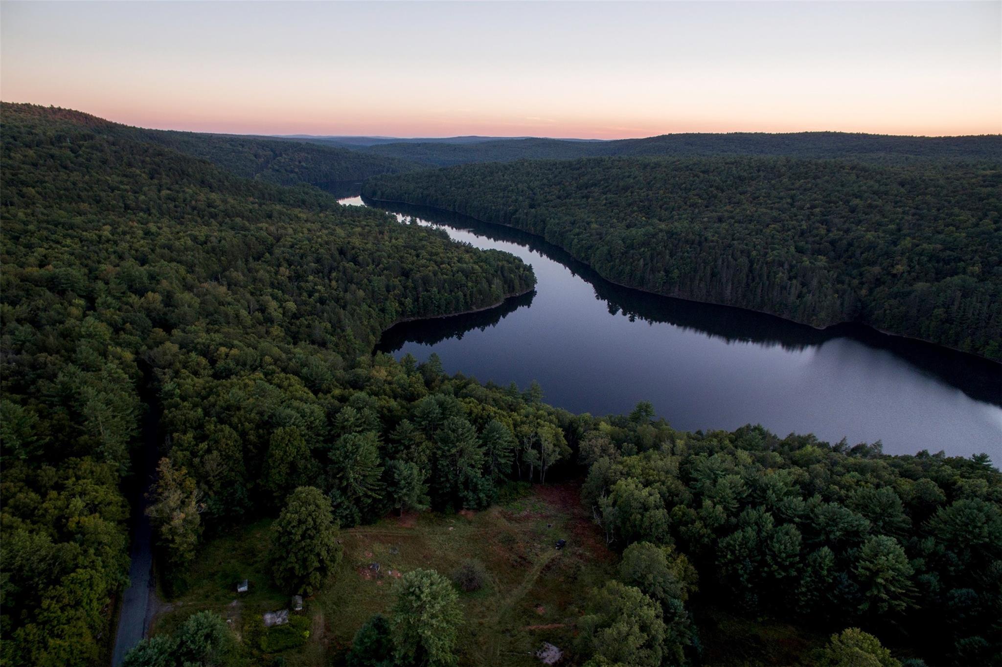 a view of a lake with mountains in the background