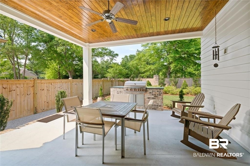 707 Cardamel Court Fairhope, AL 36532 - Photo 35 of 40 View of patio featuring ceiling fan, a grill, and an outdoor kitchen