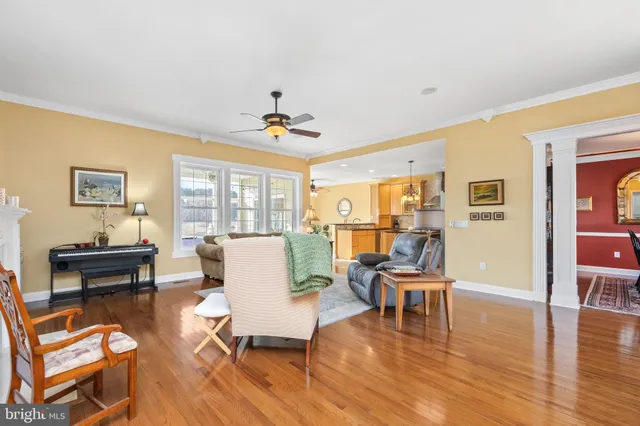 a view of a dining room with furniture and chandelier