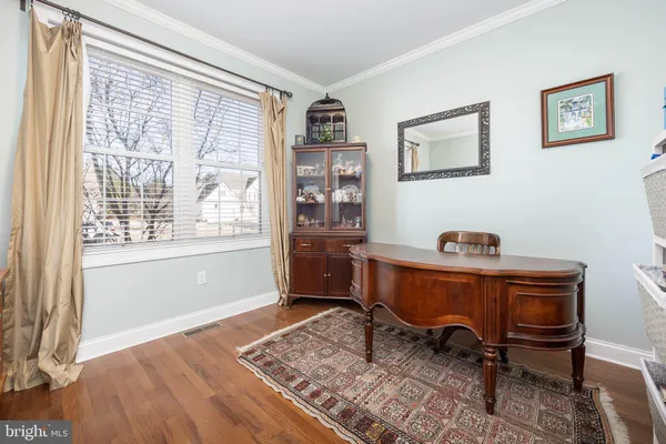 a kitchen with stainless steel appliances granite countertop a sink a stove and refrigerator
