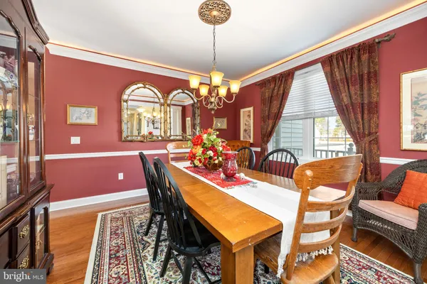 a kitchen with stainless steel appliances granite countertop a refrigerator a sink a stove and island