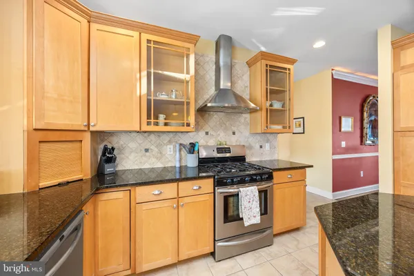 a living room with furniture chandelier and a large window