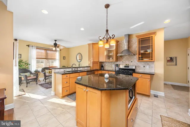 a front view of a house with outdoor seating