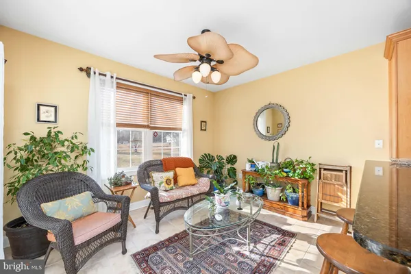a living room with furniture and a rug