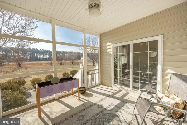 a bathroom with a sink mirror and vanity