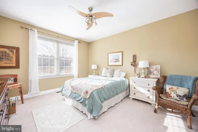 a bedroom with furniture and a rug