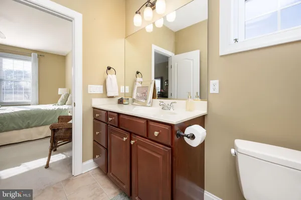 a spacious bathroom with a tub a double vanity sink and mirror