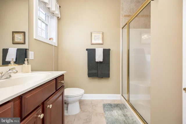 a view of walk in closet with clothes