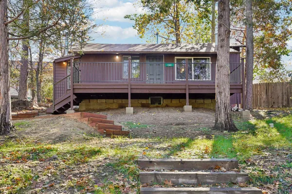 a view of house with a yard
