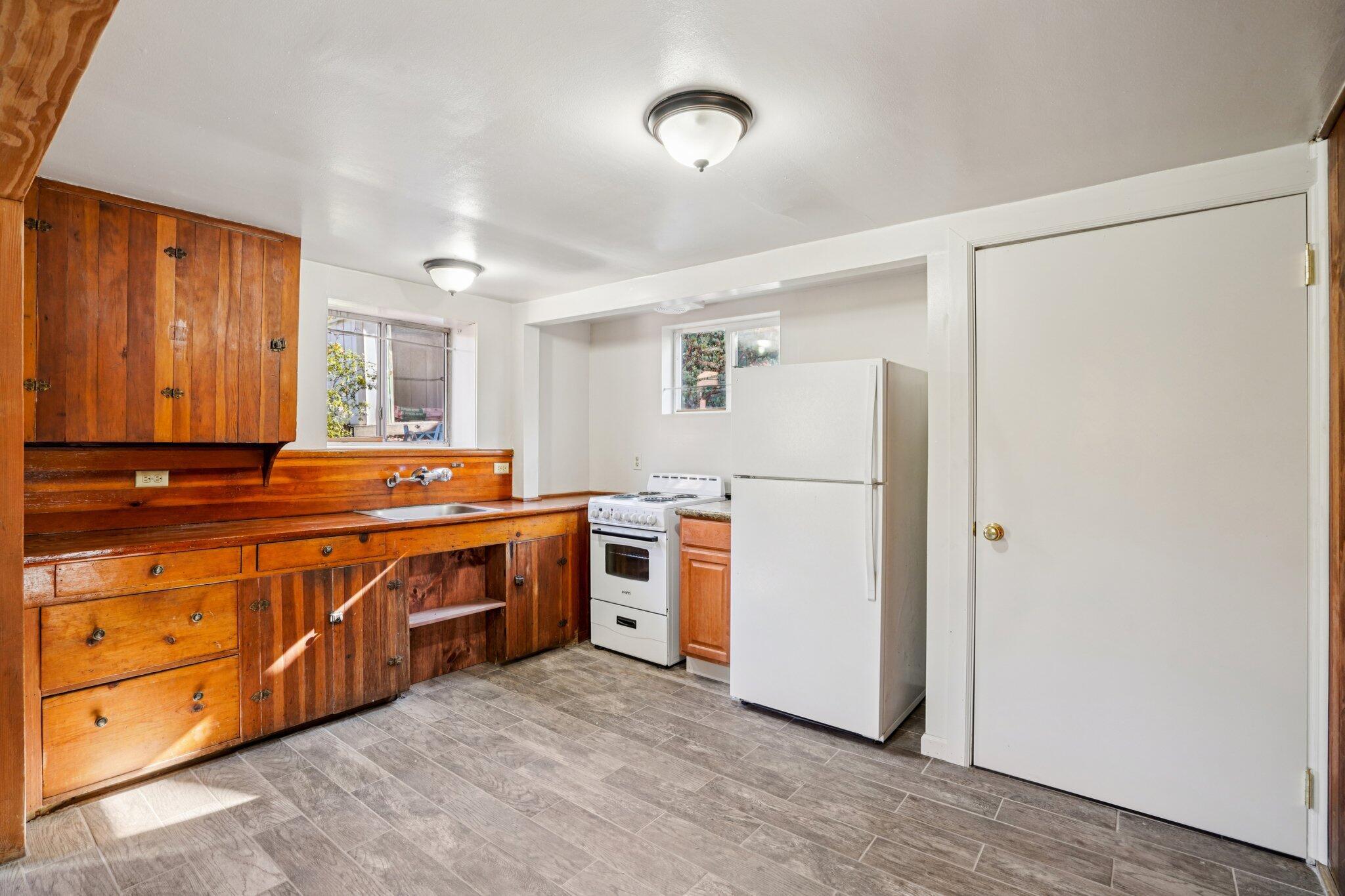 53451 Middleridge Drive Idyllwild, CA 92549 - Photo 11 of 29 a kitchen with stainless steel appliances granite countertop a refrigerator and a stove top oven